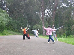seniors-exercising-with-swords-in-park-for-health